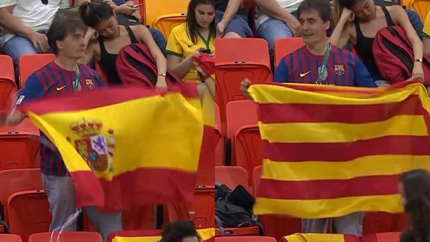 Un aficionado cambia la bandera española por la señera en el momento en el que le enfoca la cámara