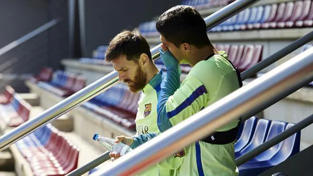 Messi, con Luis Suárez