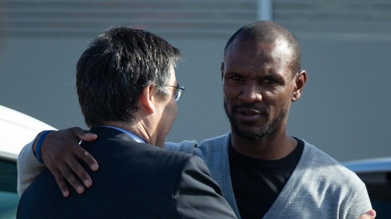 Eric Abidal y Josep Maria Bartomeu