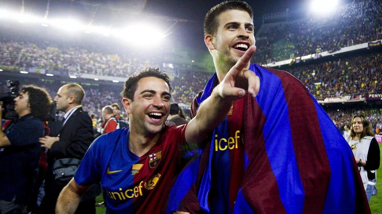 Xavi y Piqué celebran un título juntos con el Barcelona