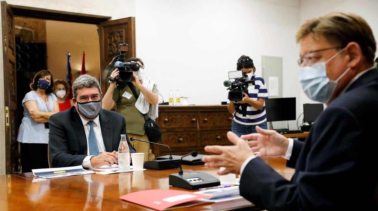 José Luis Escrivá y Ximo Puig en una reunión mantenida este jueves