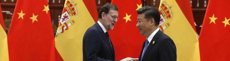 El presidente chino, Xi Jinping, y el presidente del Gobierno español en funciones, Mariano Rajoy