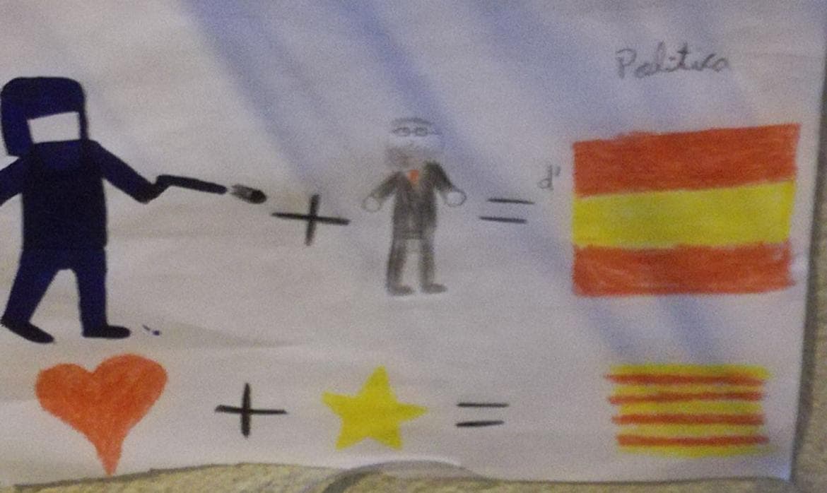 Dibujo infantil pegado en la fachada de un colegio de Barcelona