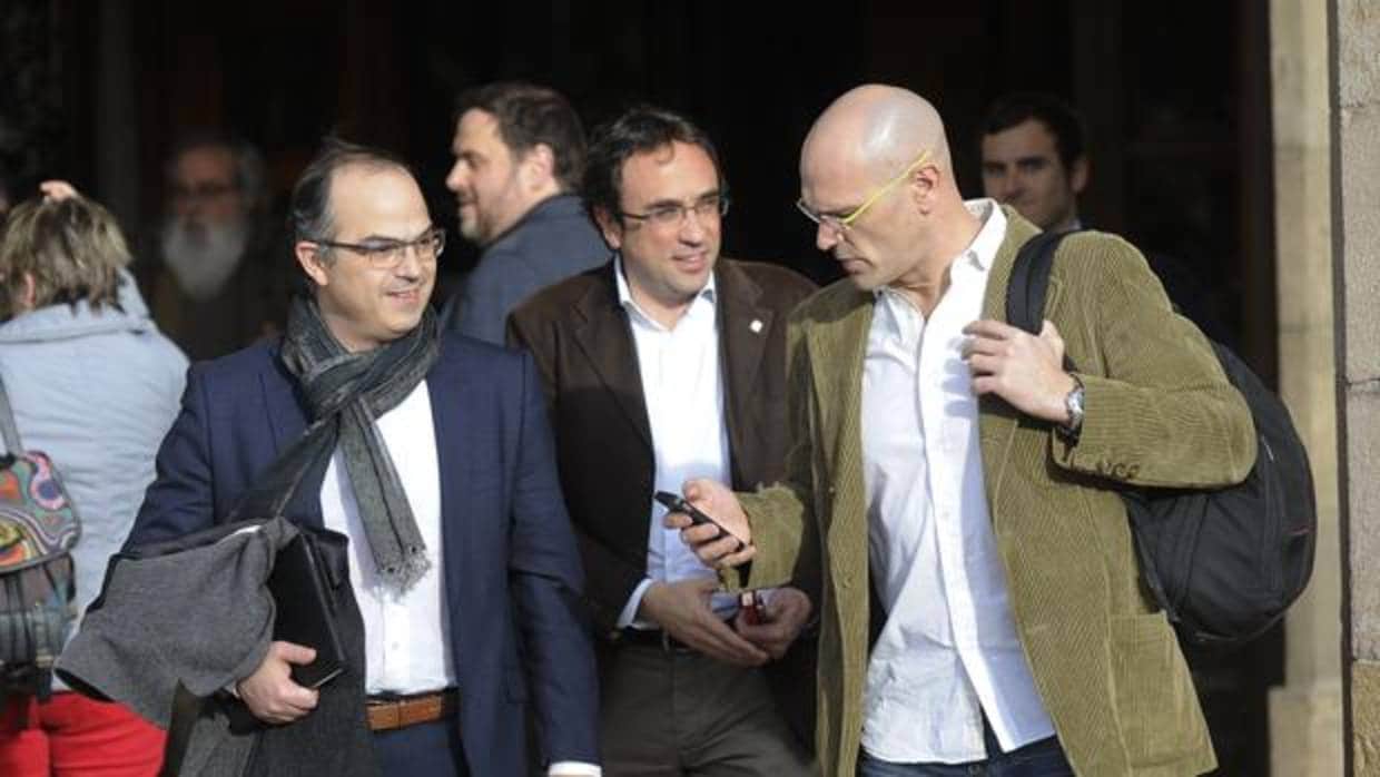 Raül Romeva, junto a Jordi Turull y Josep Rull