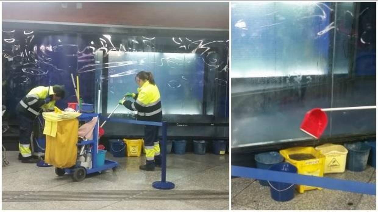 Dos operarios recogen el agua de las goteras en el monumento del 11-M