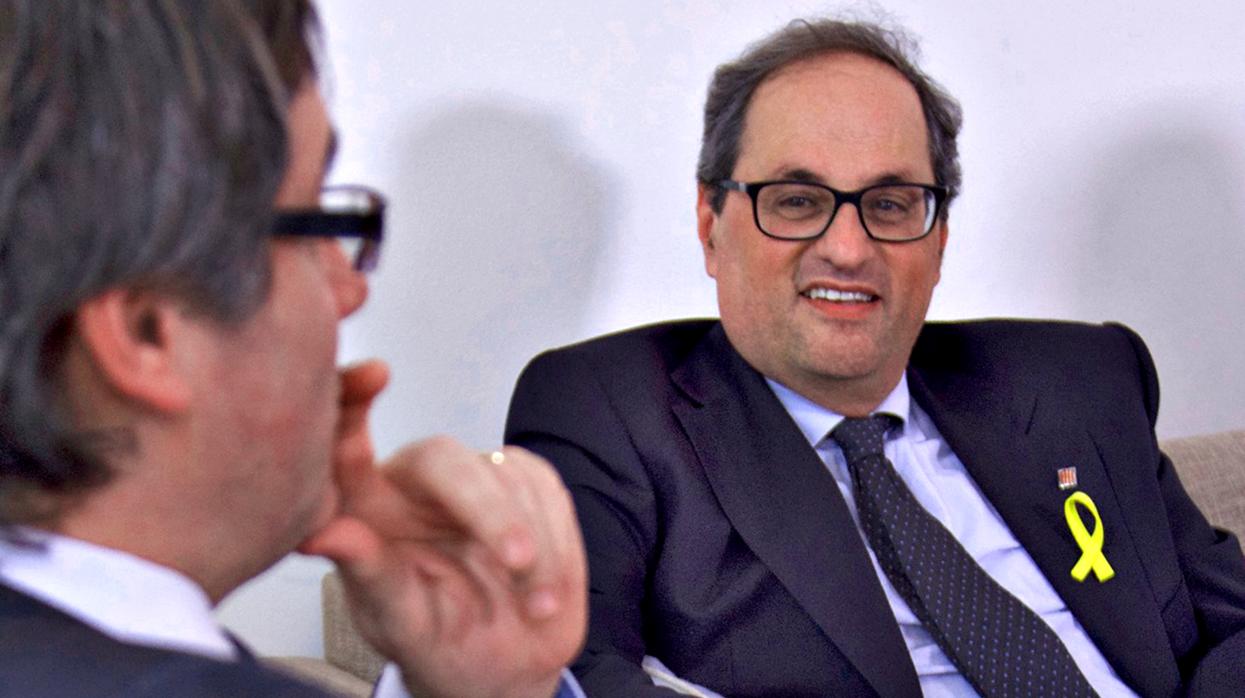 El presidente de la Generalitat, Quim Torra, y su predecesor, Carles Puigdemont