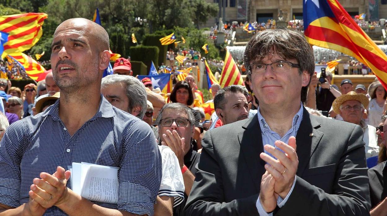 Pep Guardiola y Carles Puigdemont