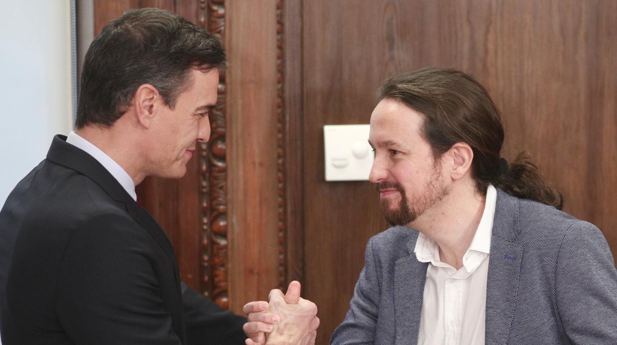 Pedro Sánchez y Pablo Iglesias, el lunes durante la presentación del acuerdo de Gobierno en el Congreso de los Diputados