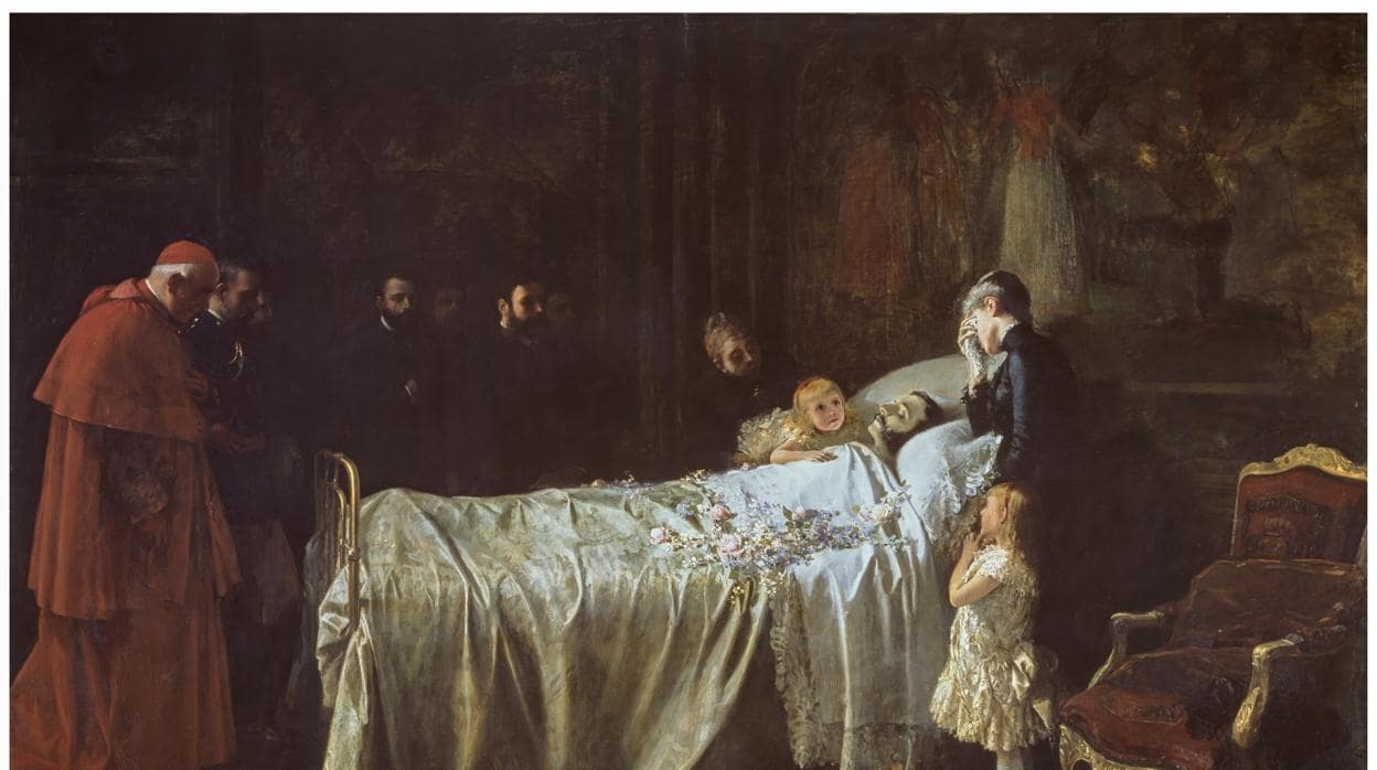 Alfonso XII yace sobre su cama, en el Palacio de El Pardo, rodeado por la Reina María Cristina y sus dos hijas, la Princesa de Asturias y la Infanta María Teresa, obra de Benlliure y Gil