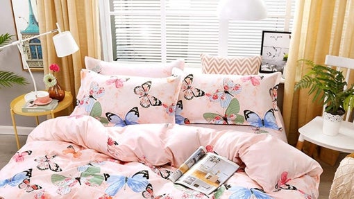 Juego de funda y almohadones con mariposas