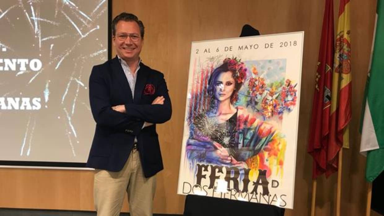 Juan Miguel Martín Mena junto a su cartel de Feria de Dos Hermanas