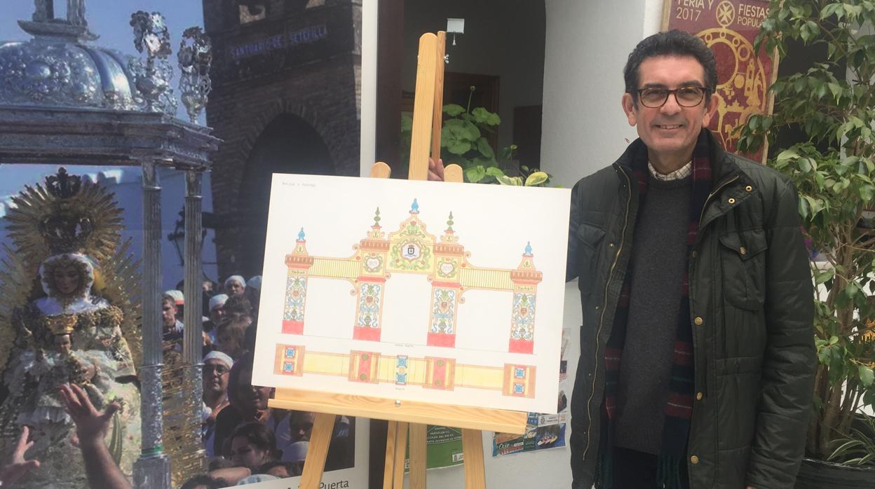 El artista loreño Manuel Nuño Heredia junto al boceto ganador del concurso de la portada del bicentenario de la feria