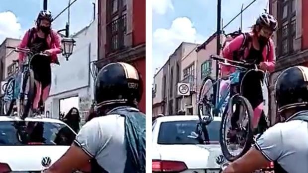 Una ciclista pasa por encima de un coche por estar aparcado en mitad del carril bici