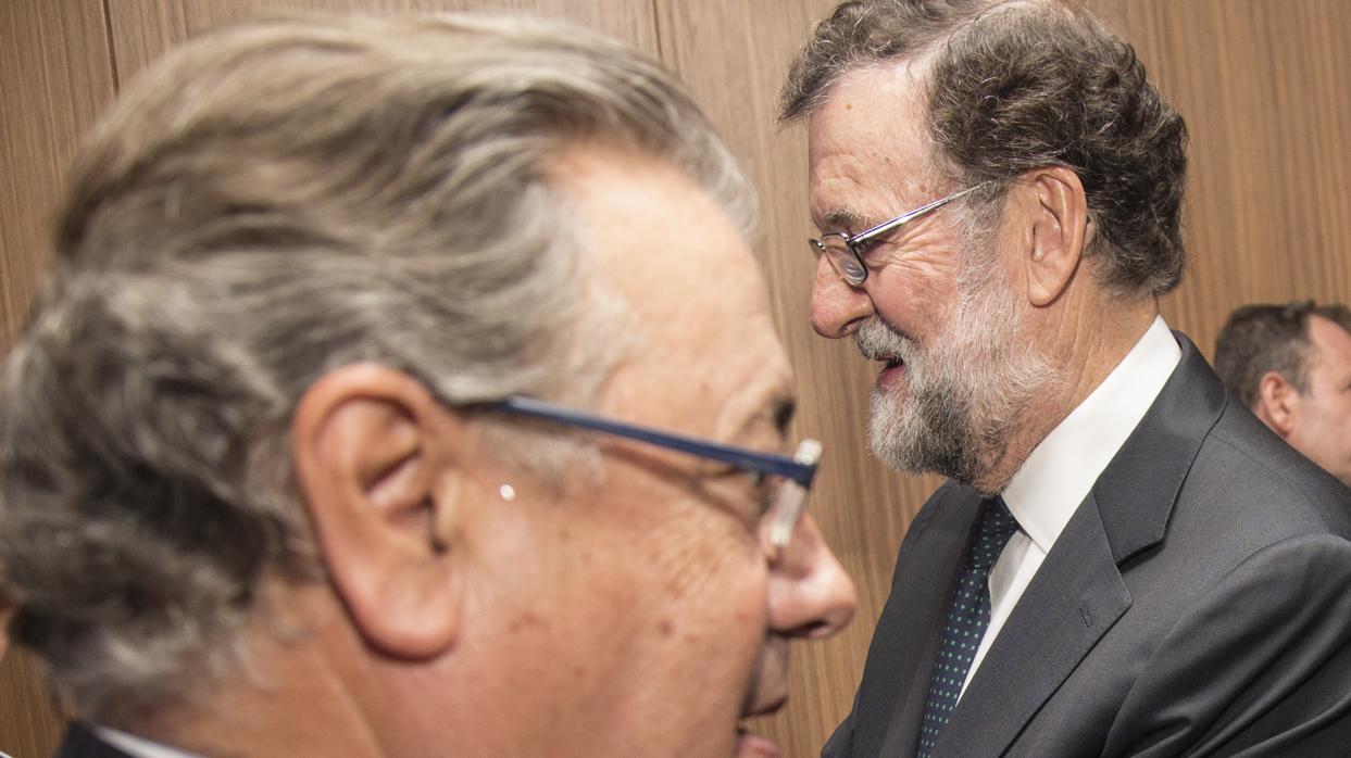 Juan Ignacio Zoido y Mariano Rajoy, este viernes en Sevilla