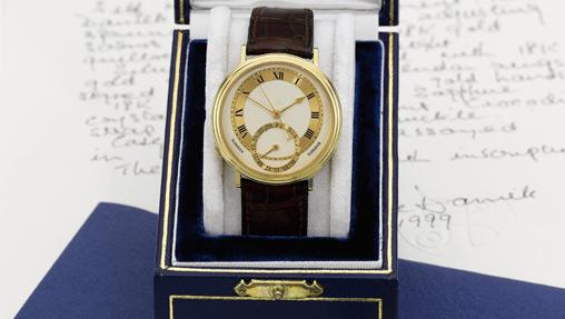 Reloj de oro amarillo automático con segundos centrales, fecha y escape Co-axial realizado en 1999