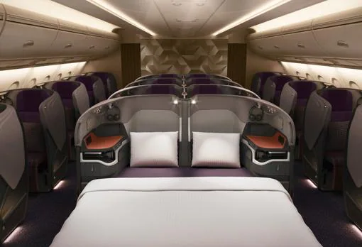 El separador central de asientos en la Business Class puede bajarse completamente hasta formar camas dobles